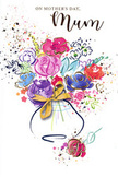 Joyful Mother's Day card illustration capturing a lively bouquet painted in flowing watercolour, echoing the relaxed, riverside charm of Shepperton. The arrangement spreads upward and outward from a small vase, forming a generous cluster of blooms in purples, reds, and pinks, softened by subtle transitions into peach, blush, and rose. Each flower is suggested by circular and petal-like strokes rather than exact detailing, but the impression of lush, open blossoms is unmistakable, as if they have just been gathered from a sunlit garden off Green Lane or nearby village paths. Deep indigo accents outline portions of the petals, lending depth and definition, while patches of cool blue and lavender slip between the warmer tones, creating a lyrical rhythm of colour across the card. Light touches of green peek out as slender stems and leaves, keeping the bouquet feeling fresh and natural. Fine lines and tiny speckles of metallic gold highlight selected areas, sparkling gently like sunlight on the Thames or the sheen of a decorative ribbon tied by a practiced hand. The vase at the base is rendered in soft, translucent blue-grey and lilac, its shape hinted at more than rigidly drawn, with a small, golden bow or band suggesting thoughtful finishing touches before the bouquet is given. Around the flowers, playful paint splatters, dots, and heart motifs drift in the white space, evoking family laughter, handwritten notes, and the excitement of Mother's Day morning. Together, these elements create a tender, uplifting image that feels like a painted hug for a much-loved mum in Shepperton.