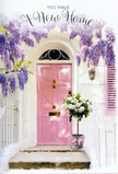 In this inviting scene, a Shepperton doorway becomes the backdrop for a tender floral welcome, perfectly capturing the spirit of a new beginning. The main focus is a softly painted pink front door, luminous yet understated, set within crisp whitewashed walls and a delicately coloured shutter that together create a calm, airy frame. The overall effect is reminiscent of the gentle charm found in the village streets near the High Street or along the river. Cascading above the doorway, wisteria trails down in graceful curtains of lavender blooms, each cluster hanging loosely and creating a fragrant, romantic canopy that seems almost to sway in an unseen breeze. At the foot of the door, a grey metal florist's bucket rests on the step, filled generously with plush white and cream roses. Their petals are rich and velvety, opening wide to reveal soft, layered hearts, while sprigs of fresh green foliage weave in between, adding texture and a just-picked freshness. A pale pink satin ribbon encircles the bucket, tied in a simple bow whose sheen catches the light and subtly reflects the door's blush hue, pulling the whole composition together. Sunlight filters through the wisteria vines overhead, casting gentle dappled shadows across the doorway and arrangement, as if the afternoon is pausing to honour this quiet moment. The image feels like a thoughtful housewarming bouquet delivered by a Shepperton florist-perfect for congratulating someone on their new address, and for turning an ordinary doorstep into a soft-spoken promise of comfort, joy, and the feeling of truly being at home.
